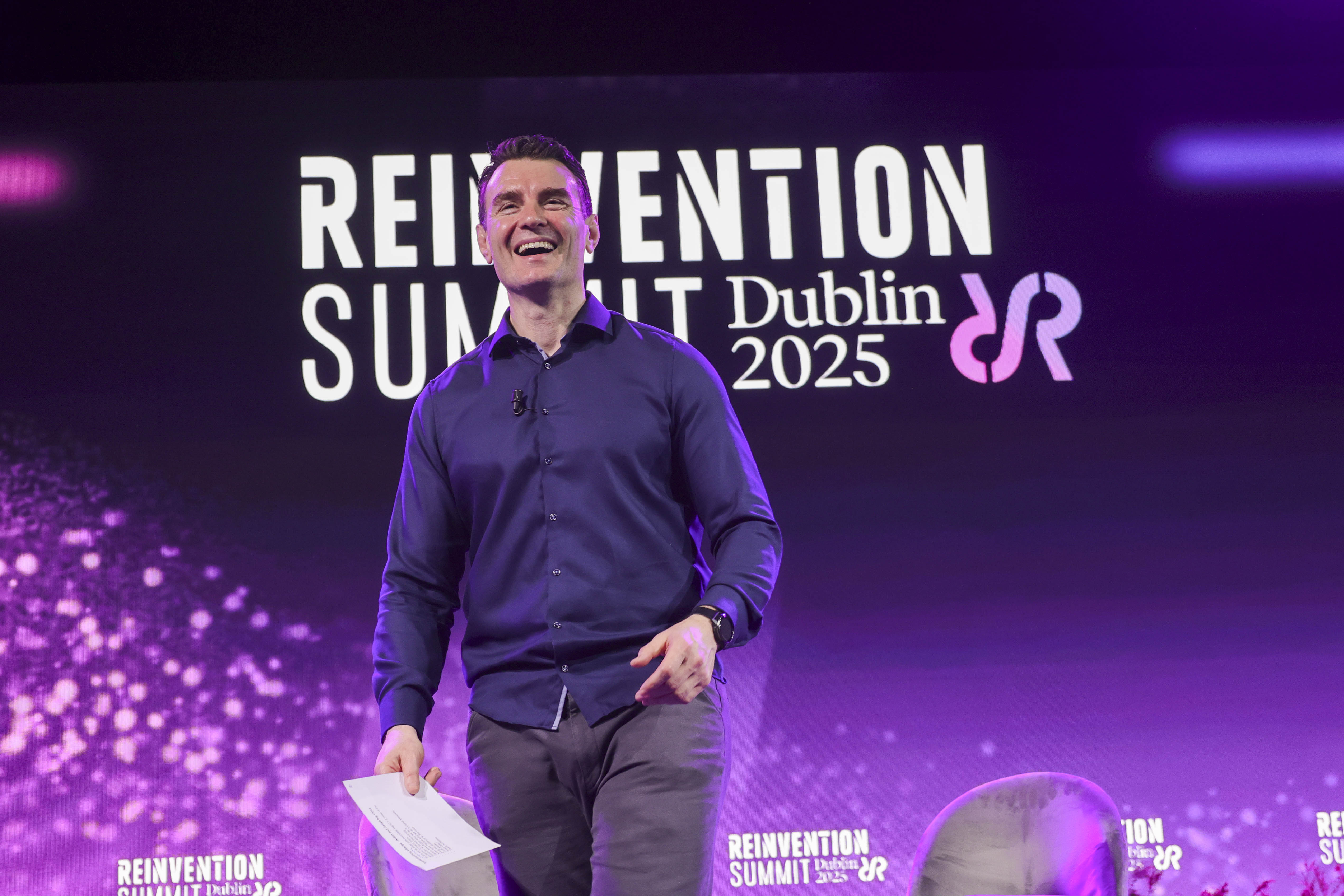 Aidan McCullen on stage at the Reinvention Summit Dublin 2025, delivering a keynote on permanent reinvention.